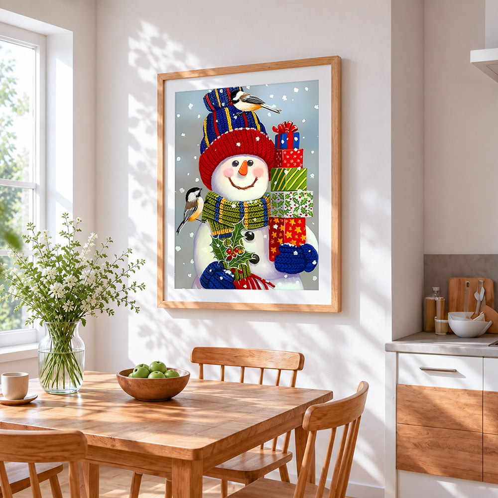 Cosy snowman with knitted hat cross stitch artwork displayed on wall as home decor