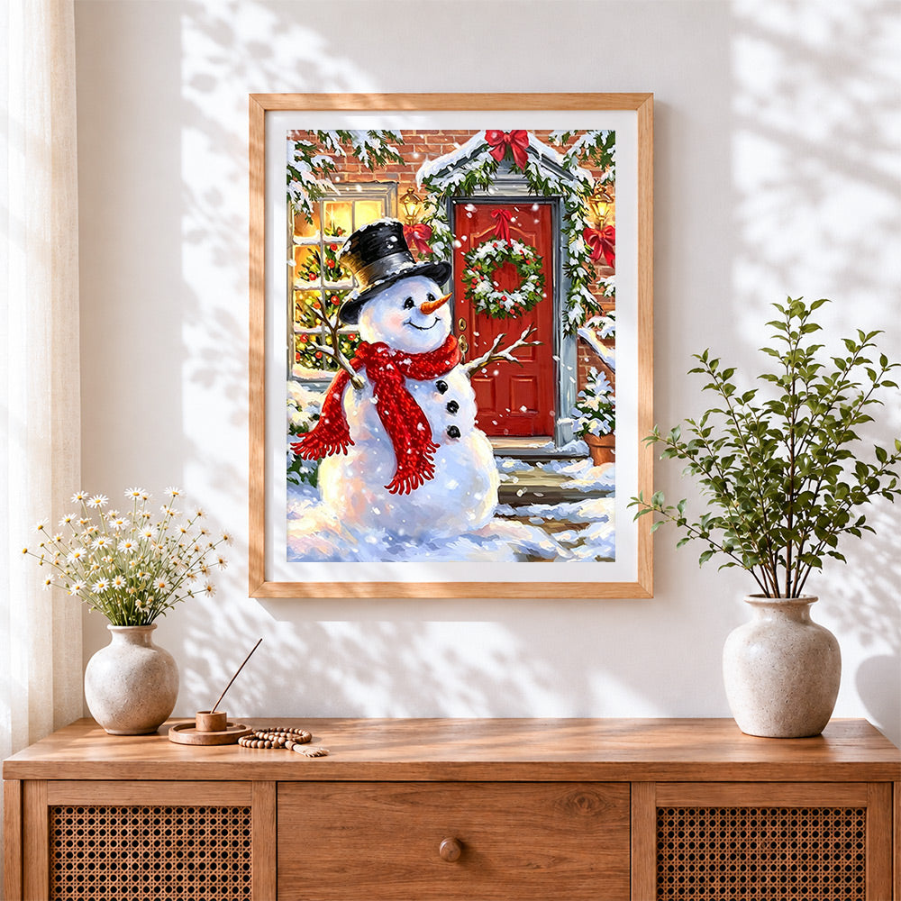 Finished cosy snowman with top hat by a red door cross stitch artwork displayed