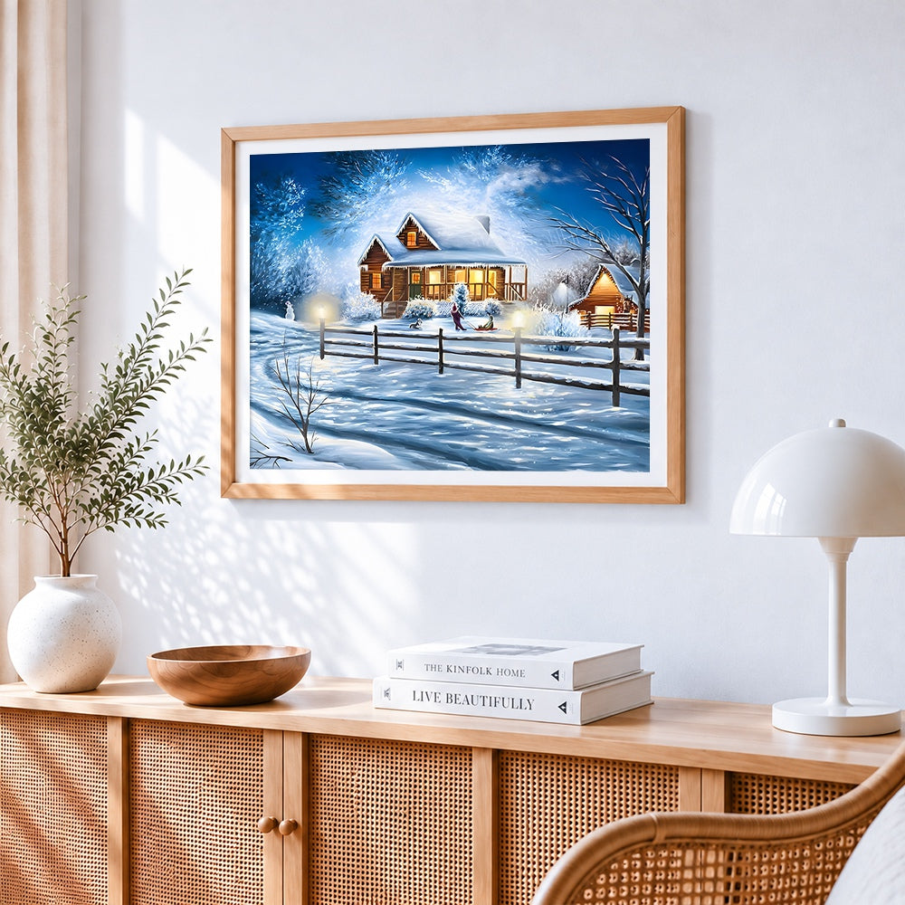 Cosy snowy cabin at twilight cross stitch artwork displayed on wall as home decor