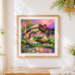 Finished cosy thatched cottage in flowers cross stitch artwork displayed