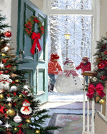 Cosy view of children building snowman cross stitch kit for beginners