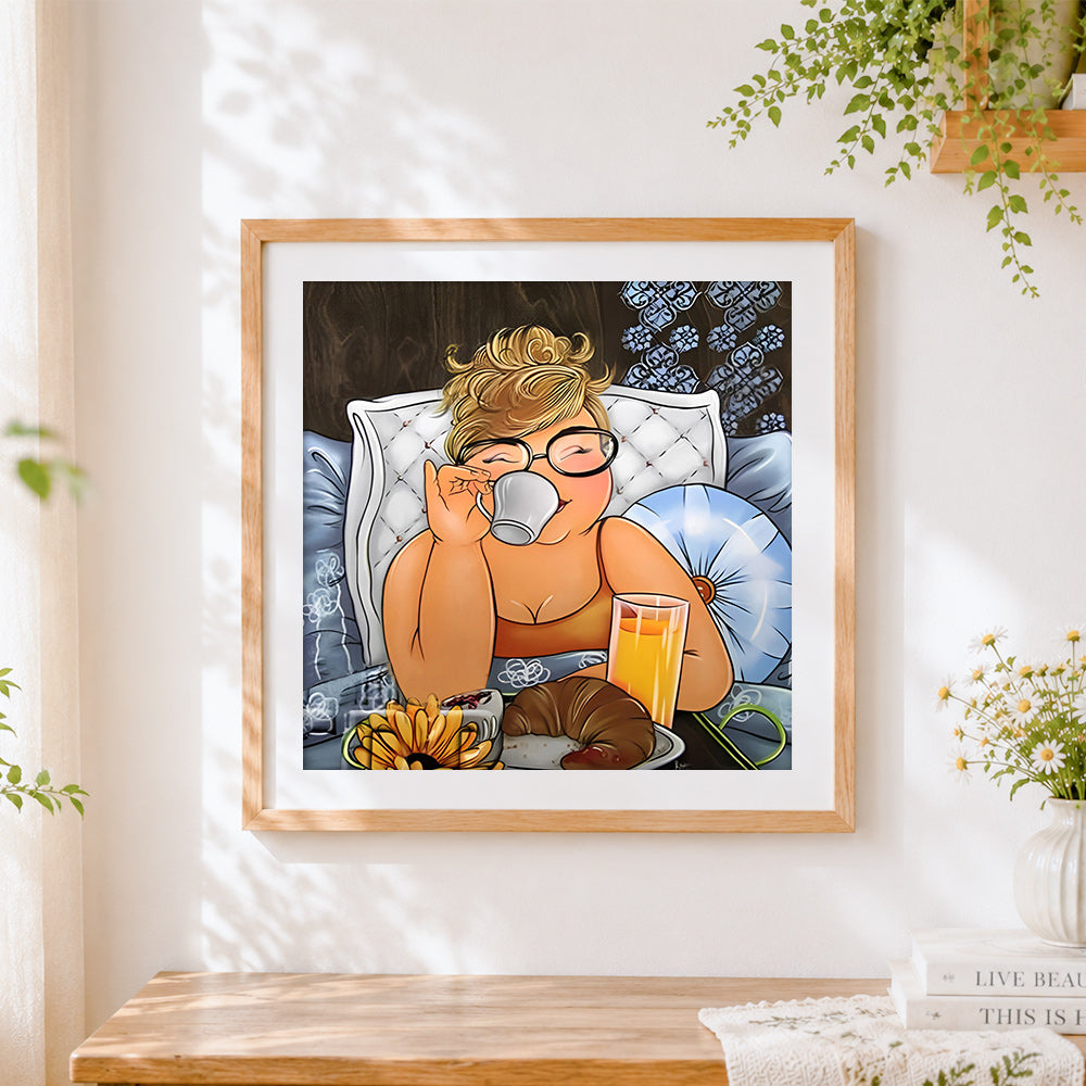 Finished cosy woman enjoying breakfast in bed cross stitch artwork displayed
