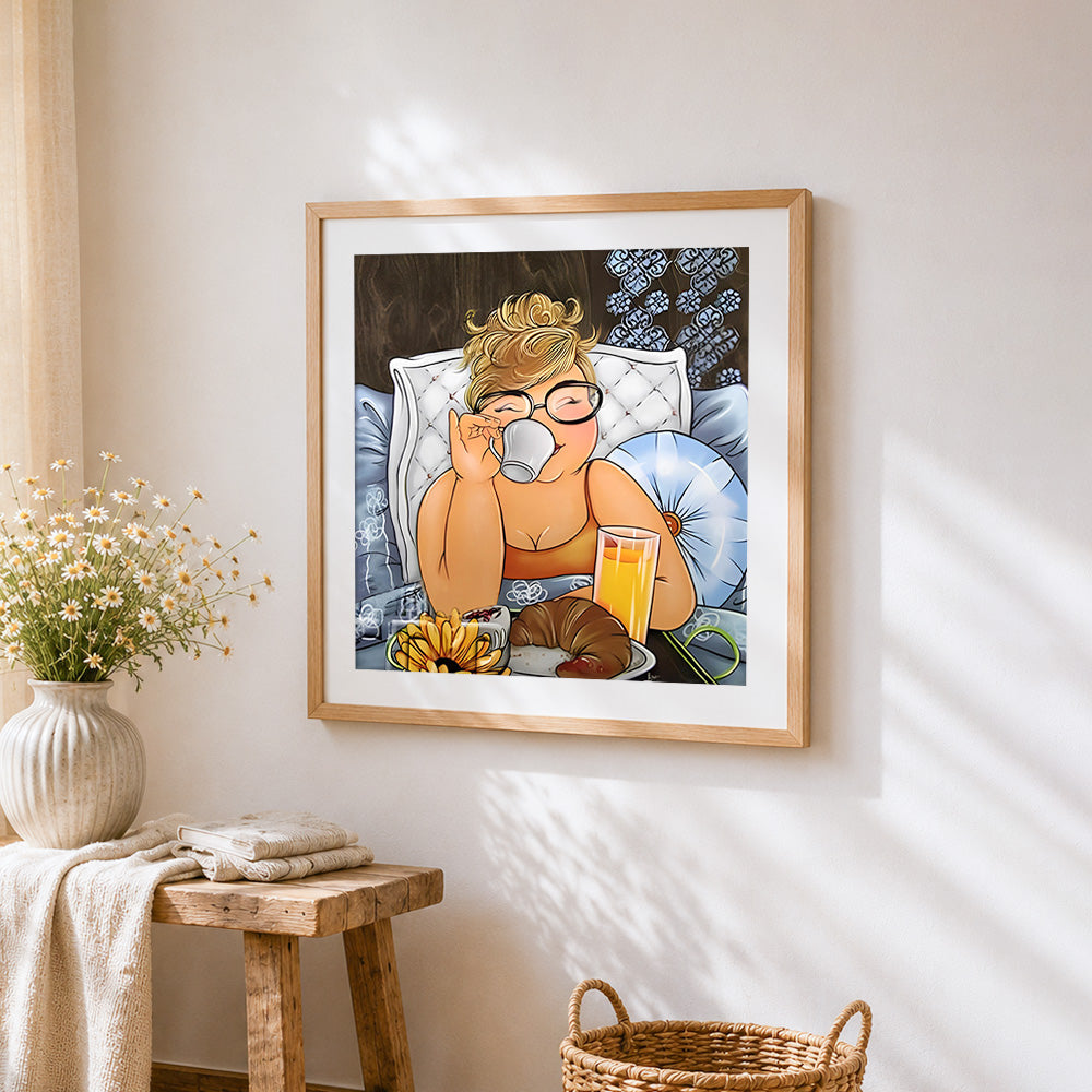 Cosy woman enjoying breakfast in bed cross stitch artwork displayed on wall as home decor
