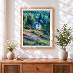 Finished cottage in a wildflower valley cross stitch artwork displayed