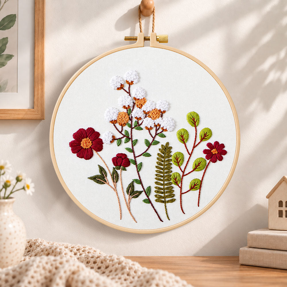 Cotton and burgundy flower arrangement embroidery hoop wall art displayed as warm and cosy handmade home decor
