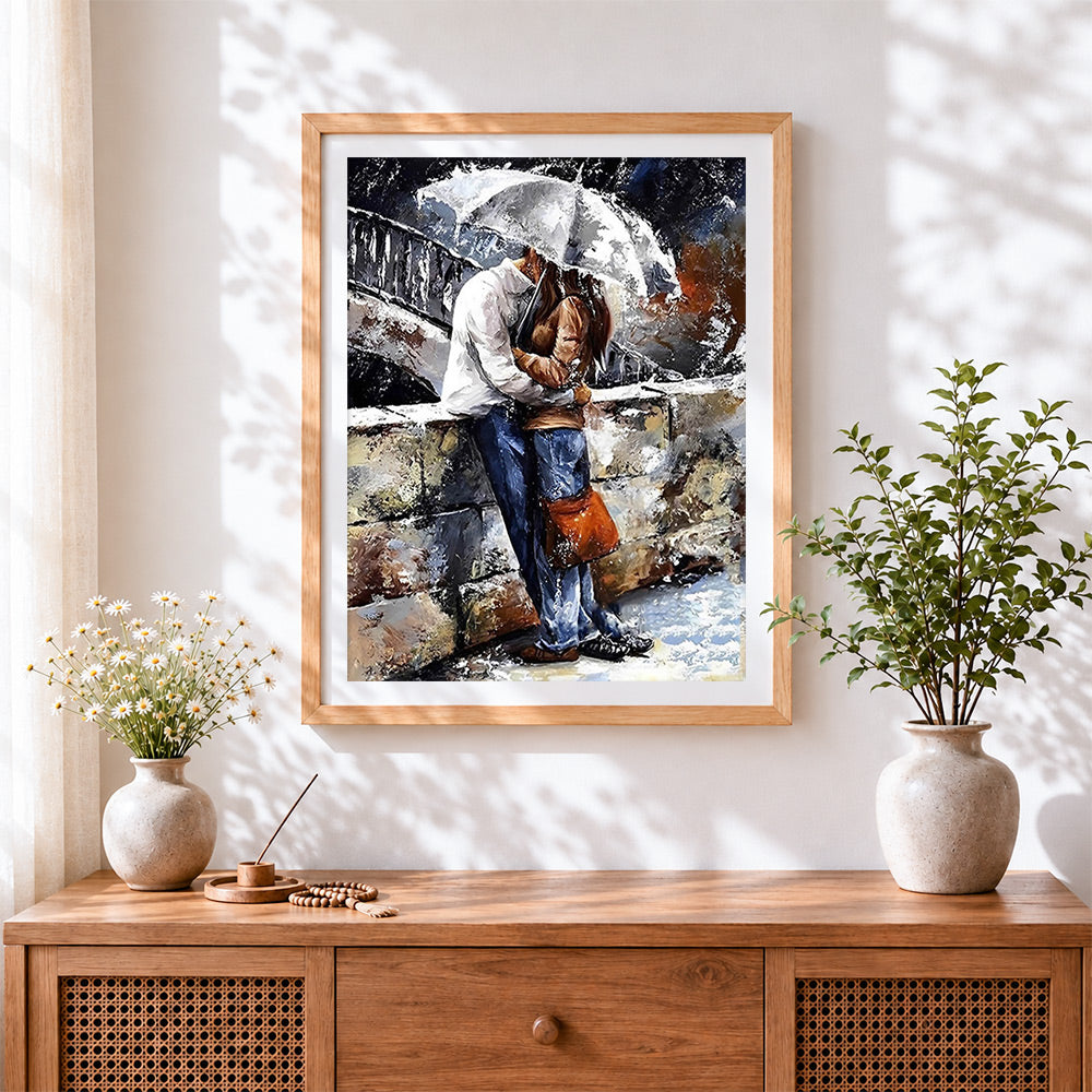 Finished couple hugging in heavy rain cross stitch artwork displayed