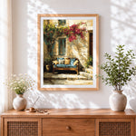 Finished courtyard sofa and bougainvillea cross stitch artwork displayed
