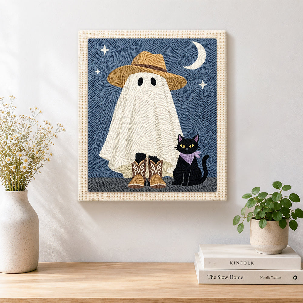 Finished cowboy ghost and black cat artwork displayed on a wall