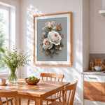 Cream roses and butterflies cross stitch artwork displayed on wall as home decor
