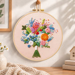 Cream wildflower bouquet embroidery hoop wall art displayed as warm and cosy handmade home decor