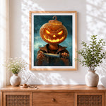 Finished creepy pumpkin head with knife cross stitch artwork displayed