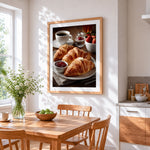 Croissants and coffee breakfast cross stitch artwork displayed on wall as home decor