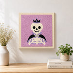 Finished crown skeleton artwork displayed on a wall
