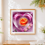Finished crystal heart with orange rose cross stitch artwork displayed