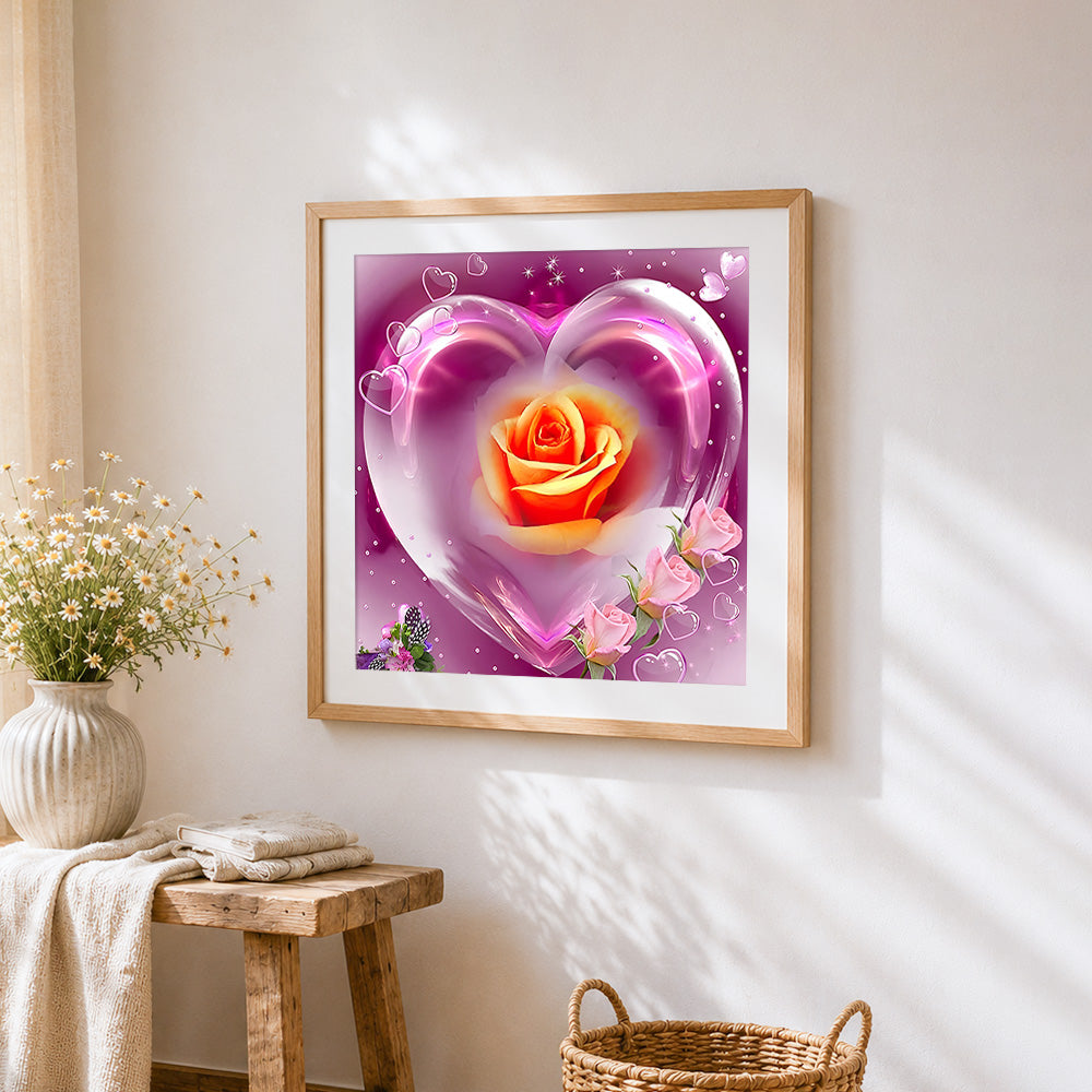 Crystal heart with orange rose cross stitch artwork displayed on wall as home decor