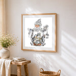 Crystal santa claus snow globe cross stitch artwork displayed on wall as home decor