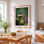 Curious squirrel and bluebird on a toadstool cross stitch artwork displayed on wall as home decor