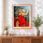 Finished curvy blonde woman with red wine cross stitch artwork displayed