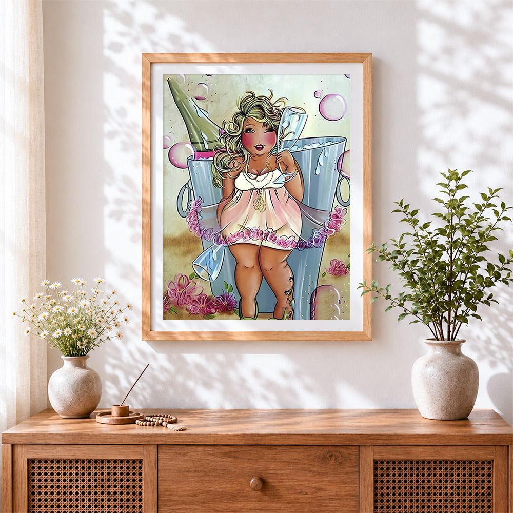 Finished curvy woman and champagne cross stitch artwork displayed