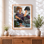 Finished curvy woman vacuuming with headphones cross stitch artwork displayed