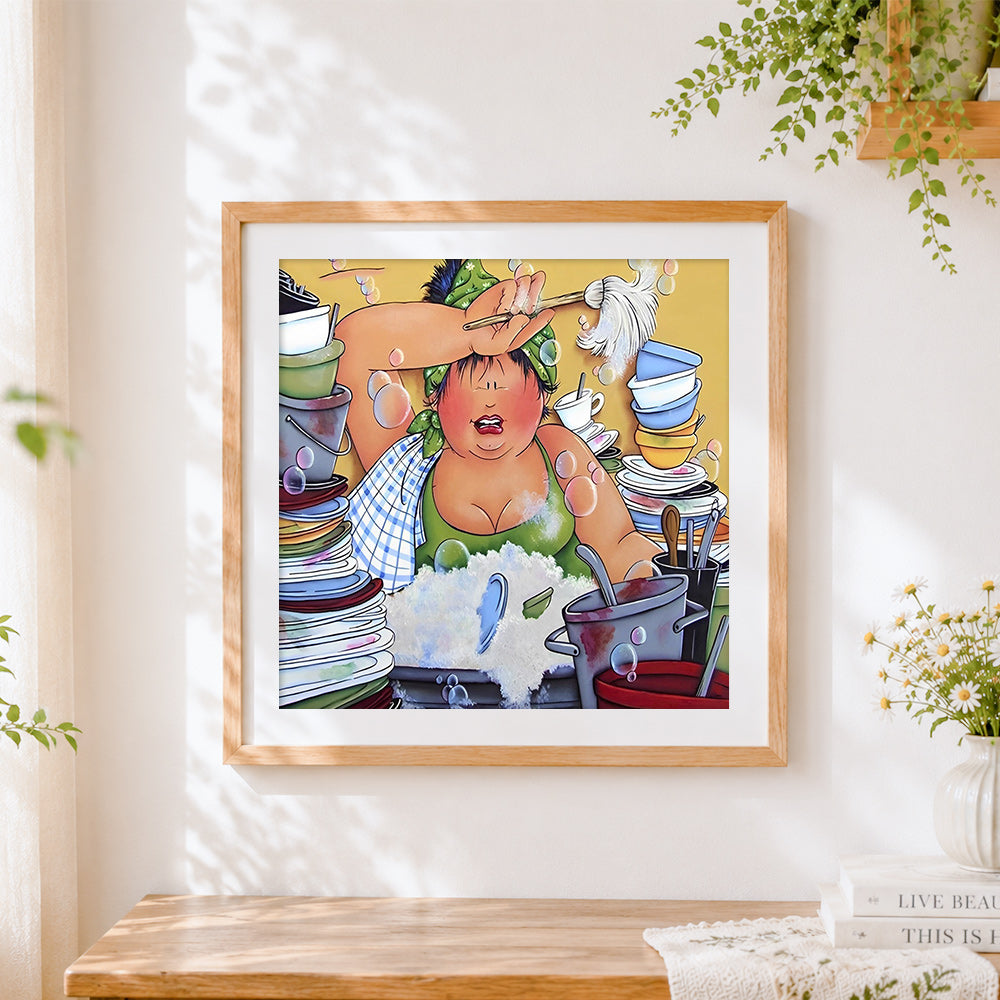 Finished curvy woman washing dishes cross stitch artwork displayed
