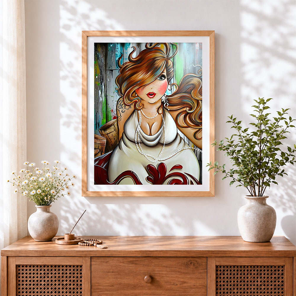 Finished curvy woman with pearl necklace cross stitch artwork displayed