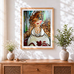Finished curvy woman with pearl necklace cross stitch artwork displayed