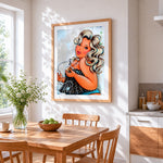 Curvy woman with perfume bottle cross stitch artwork displayed on wall as home decor