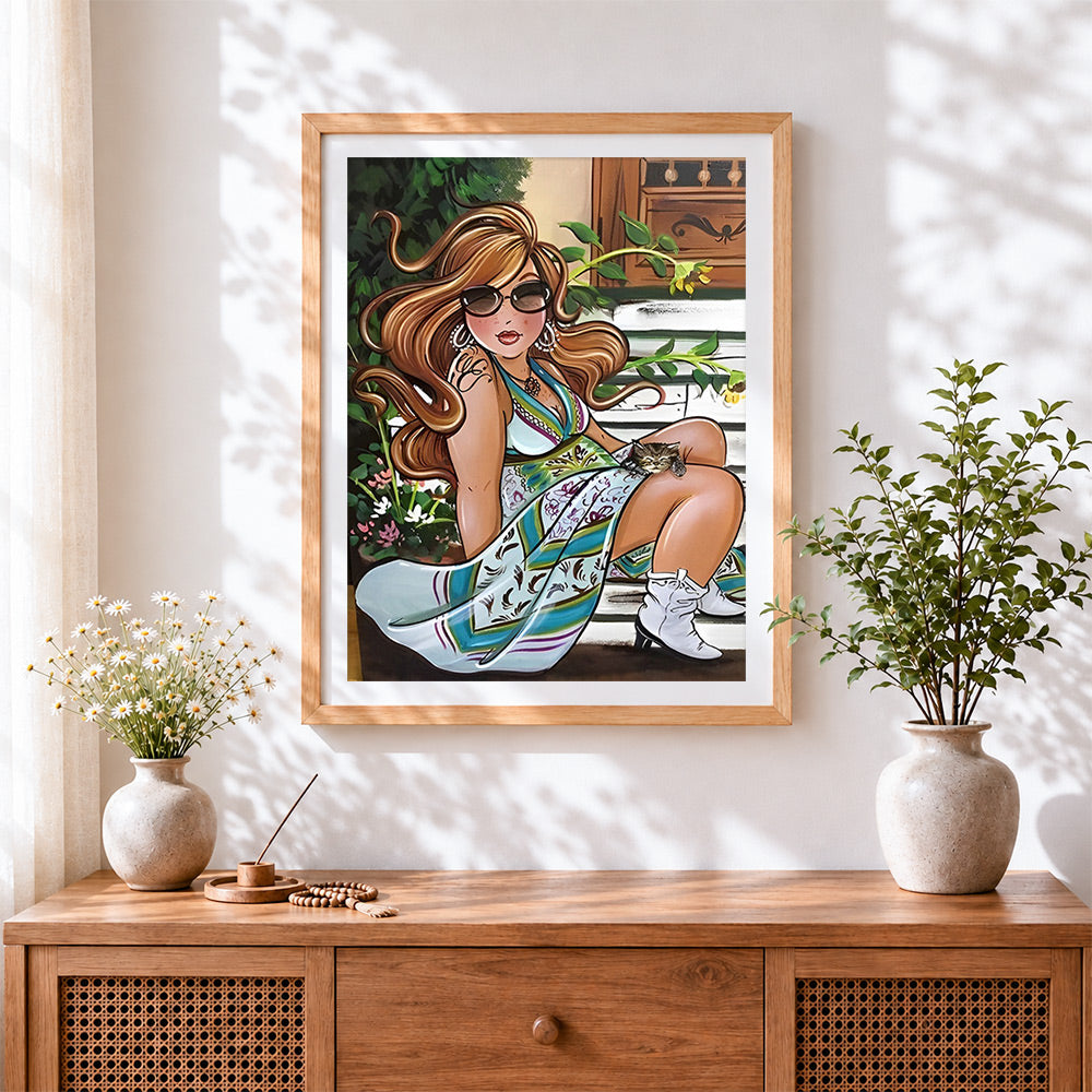 Finished curvy woman with sunglasses cross stitch artwork displayed