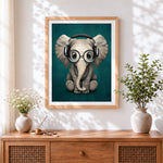 Finished cute baby elephant with headphones cross stitch artwork displayed