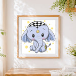 Finished cute baby elephant with star cross stitch artwork displayed
