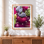 Finished cute bear on a bauble cross stitch artwork displayed