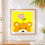 Finished cute bear with flower on head cross stitch artwork displayed