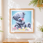 Finished cute bear with pink flowers paint by numbers artwork displayed as home decor