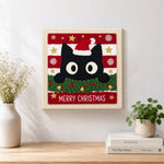 Finished cute black cat christmas portrait artwork displayed on a wall