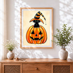 Finished cute black cat in a pumpkin cross stitch artwork displayed