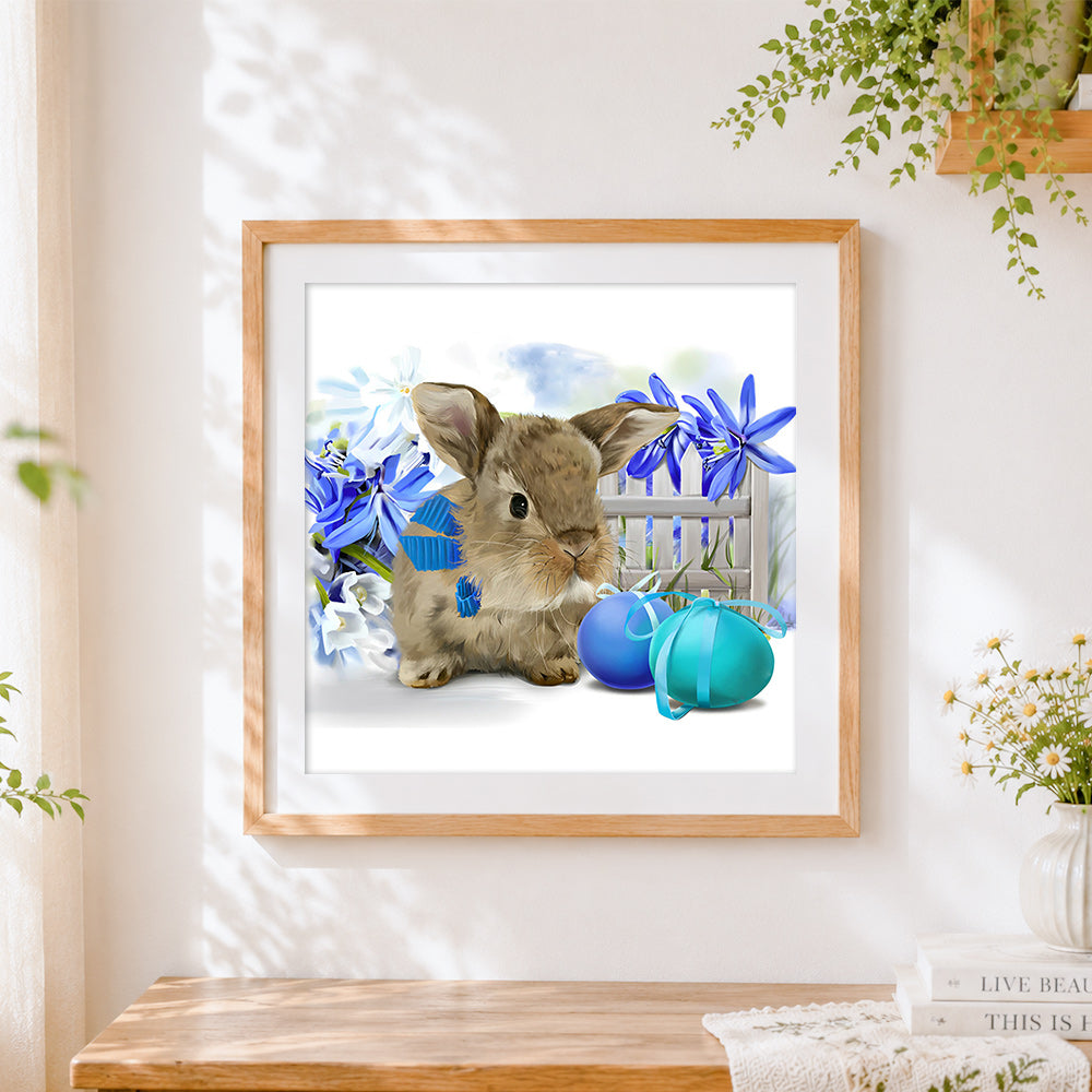 Finished cute bunny blue flowers and easter eggs cross stitch artwork displayed