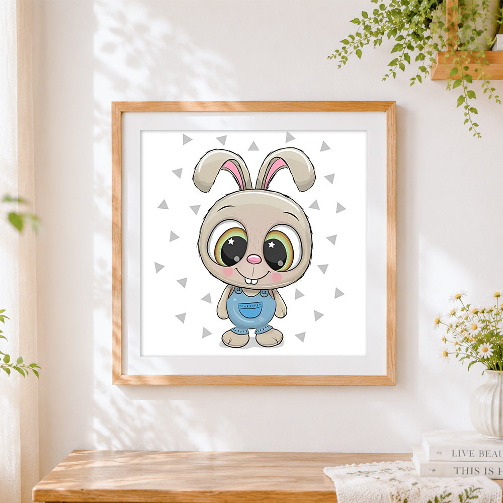 Finished cute cartoon bunny in dungarees cross stitch artwork displayed