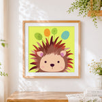 Finished cute cartoon hedgehog cross stitch artwork displayed