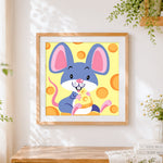 Finished cute cartoon mouse eating cheese cross stitch artwork displayed