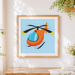Finished cute cartoon orange helicopter cross stitch artwork displayed