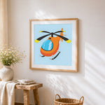 Cute cartoon orange helicopter cross stitch artwork displayed on wall as home decor