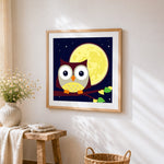 Cute cartoon owl and full moon cross stitch artwork displayed on wall as home decor