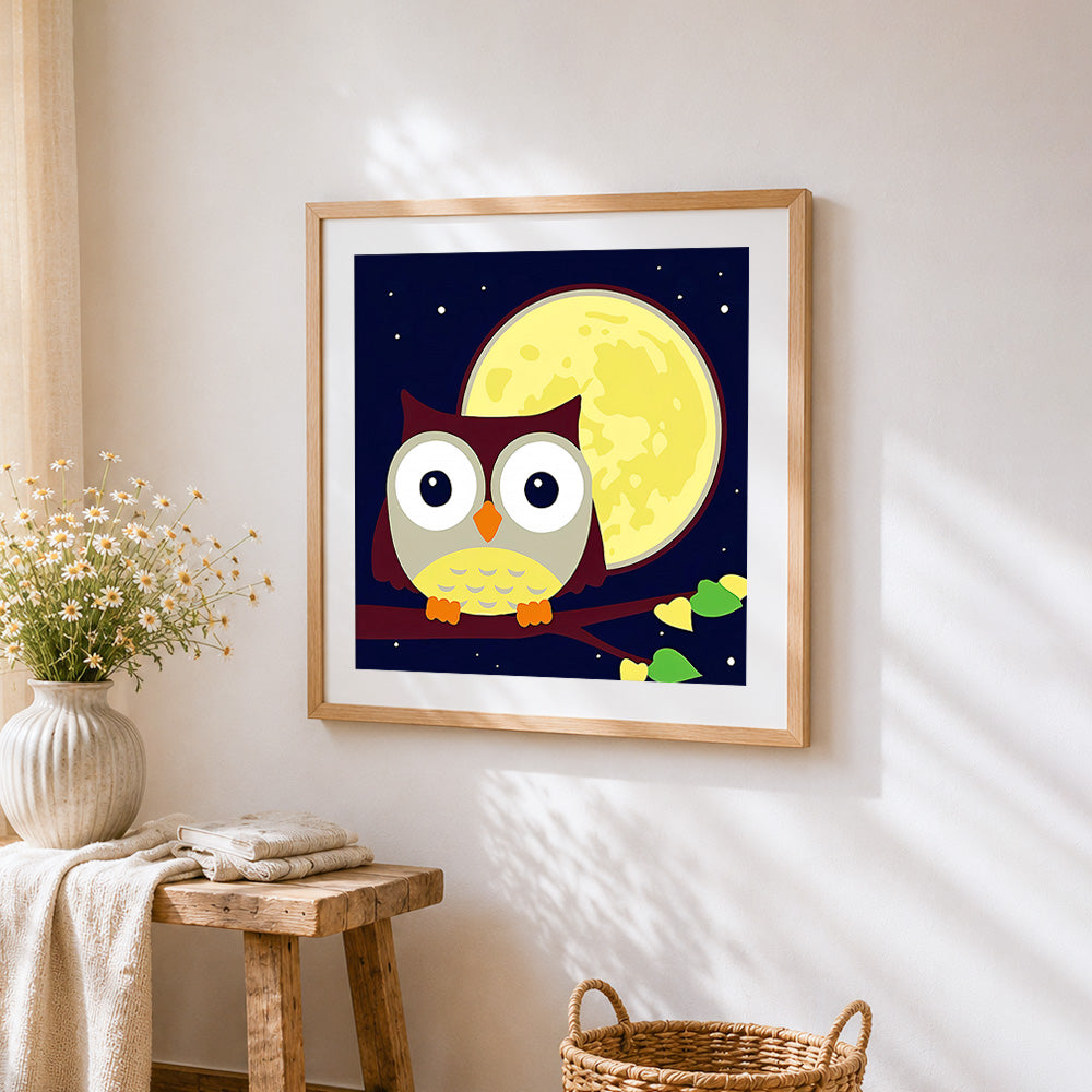 Cute cartoon owl and full moon cross stitch artwork displayed on wall as home decor