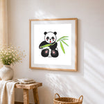 Cute cartoon panda with bamboo cross stitch artwork displayed on wall as home decor