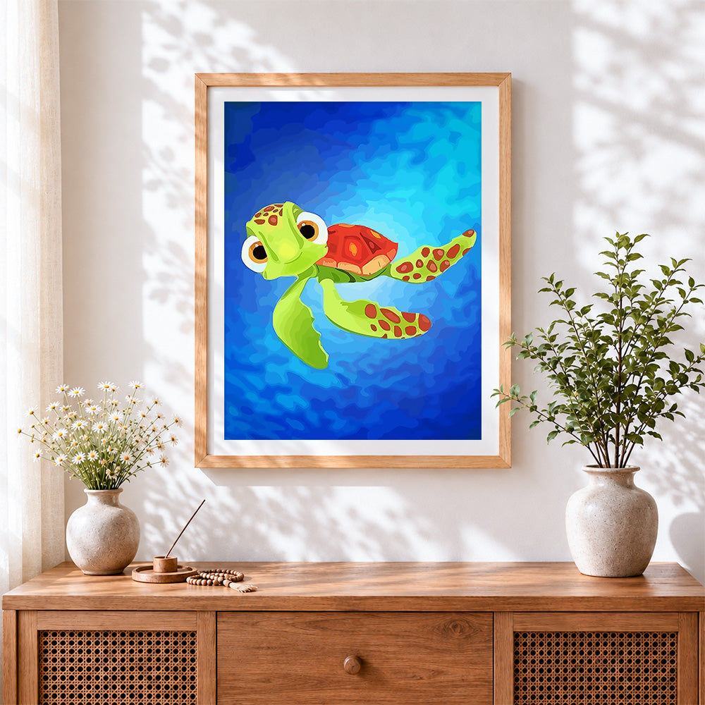 Finished cute cartoon sea turtle cross stitch artwork displayed