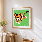Cute cartoon tiger cub cross stitch artwork displayed on wall as home decor