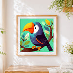 Finished cute cartoon toucan cross stitch artwork displayed