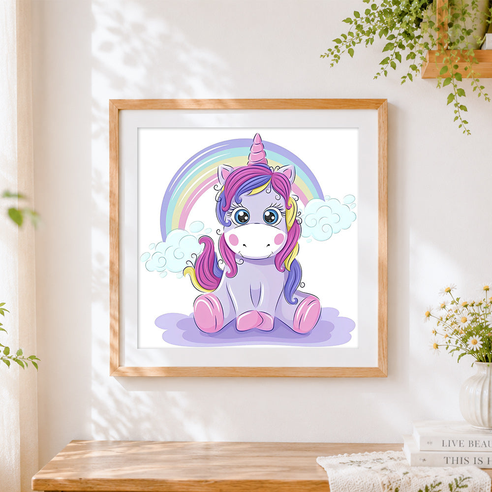 Finished cute cartoon unicorn with rainbow cross stitch artwork displayed