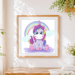 Finished cute cartoon unicorn with rainbow paint by numbers artwork displayed as home decor